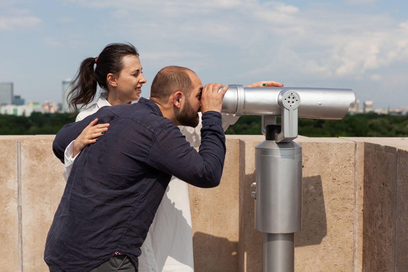Couple of lovers spending relationship anniversary on building rooftop